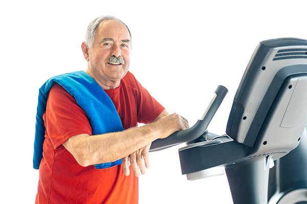 Healthy senior man on a treadmill enjoying the benefits of exercise